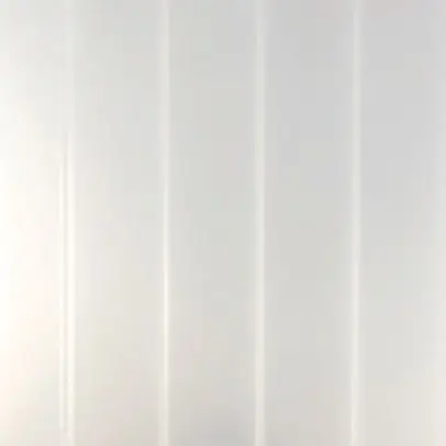 Close-up of a bronze-tinted Solar Cool acrylic panel, featuring a smooth finish and specialized light-diffusing properties designed for heat reduction.