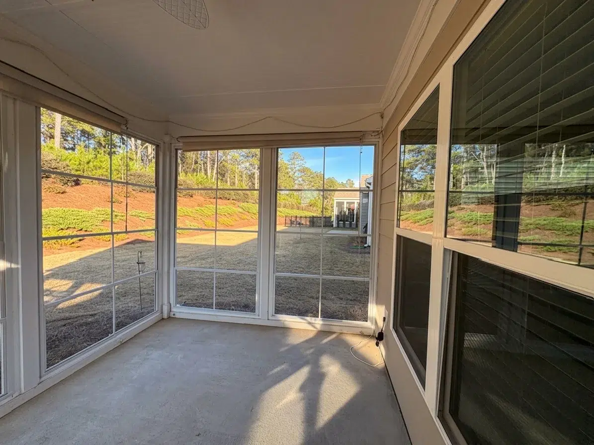 Sunspace sunroom interior corner glass panels backyard view Atlanta